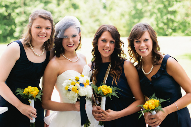 navy bridesmaids yellow bouquets