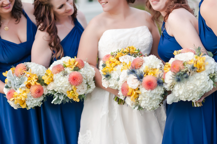 bright blue bridesmaids neutral bouquets