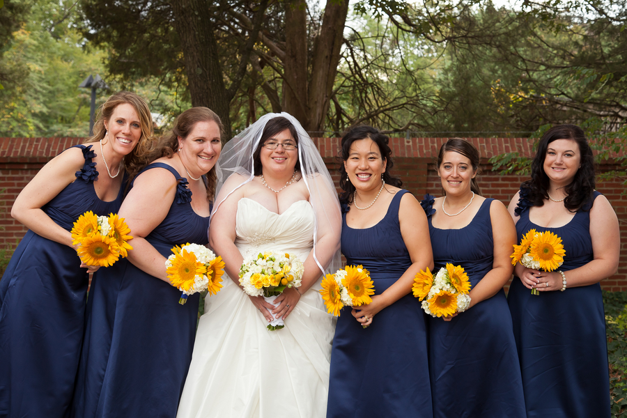 navy blue long bridesmaids dresses yellow bouquets