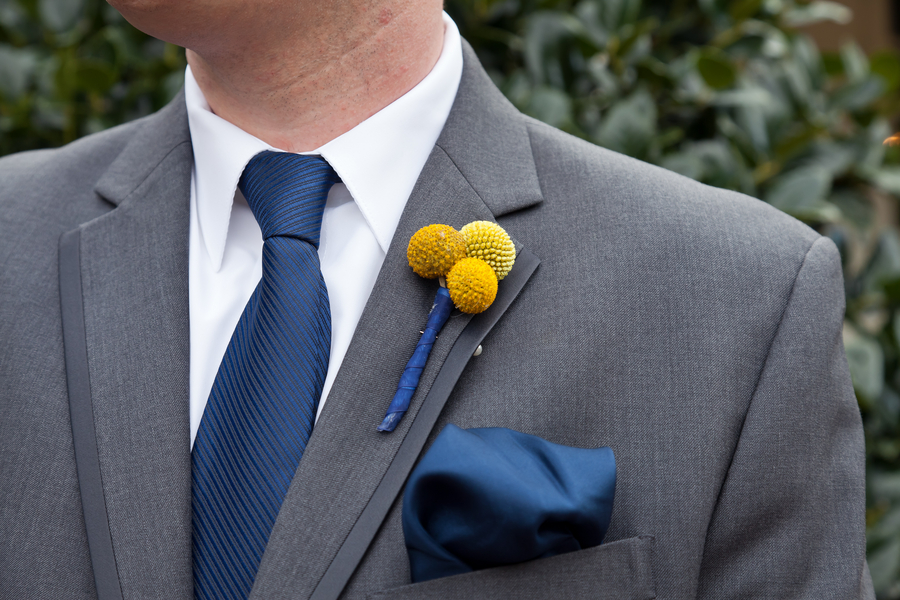 groom in grey suit billy ball boutonniere