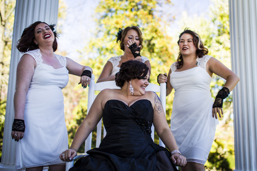 offbeat nontraditional bride black bridesmaids white dresses