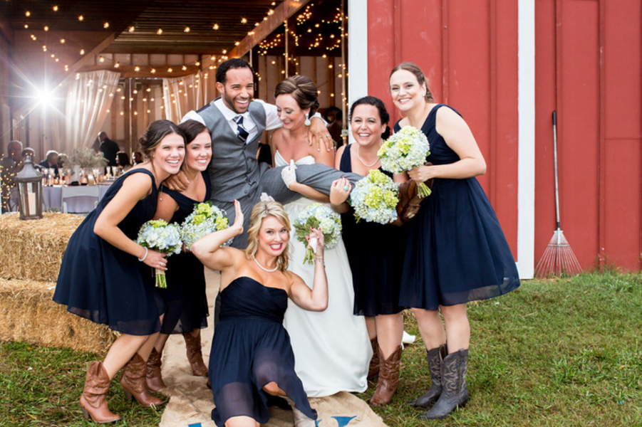 bridesmaids in navy blue and cowboy boots